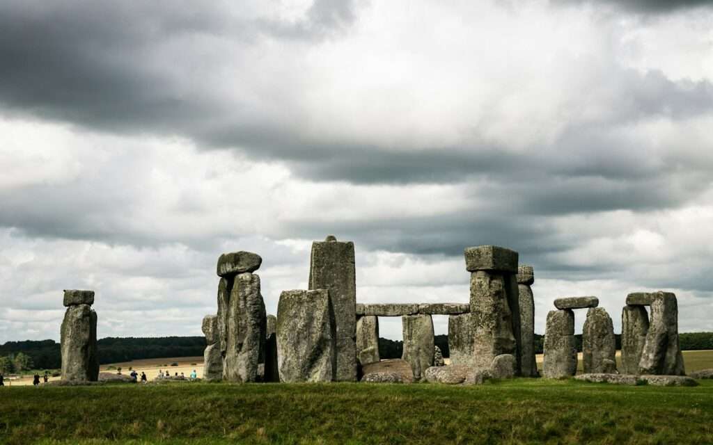 The standing stones of Stonehenge under a stormy sky