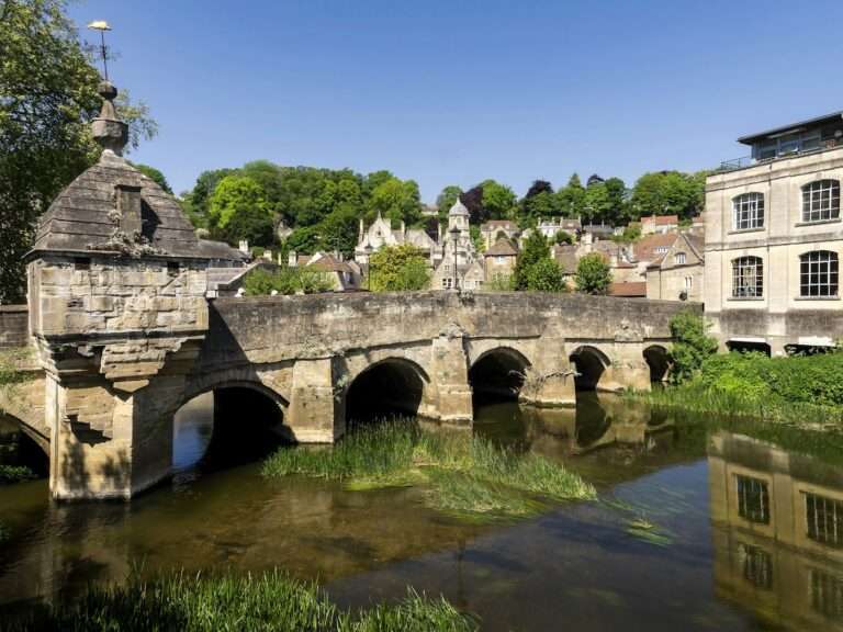 Stone town of Bradford-on-Avon rising above its medieval bridge on the River Avon